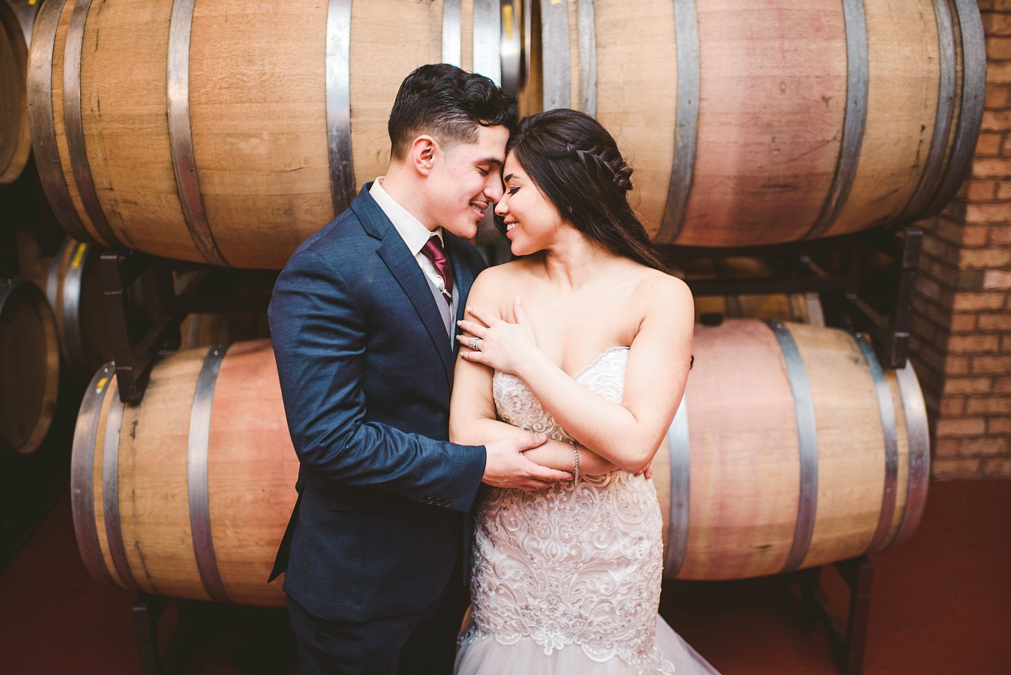 Bride and Groom with wine barrels